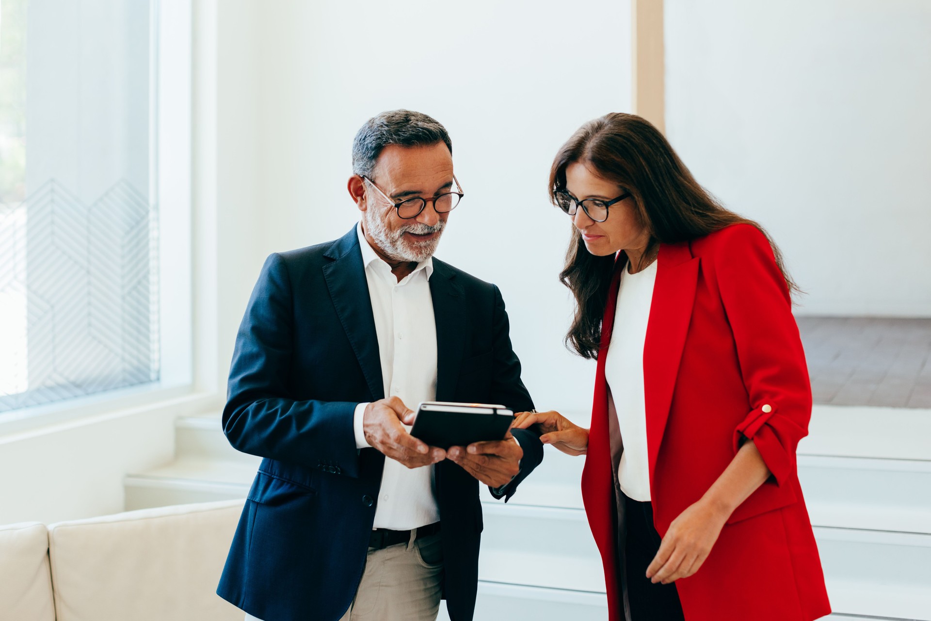 Senior professionals discussing business information during a meeting